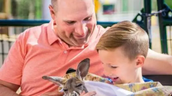 a man holding a baby