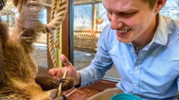 a man petting an animal
